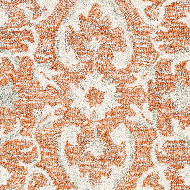 5’ x 8’ Orange and Ivory Medallion Area Rug