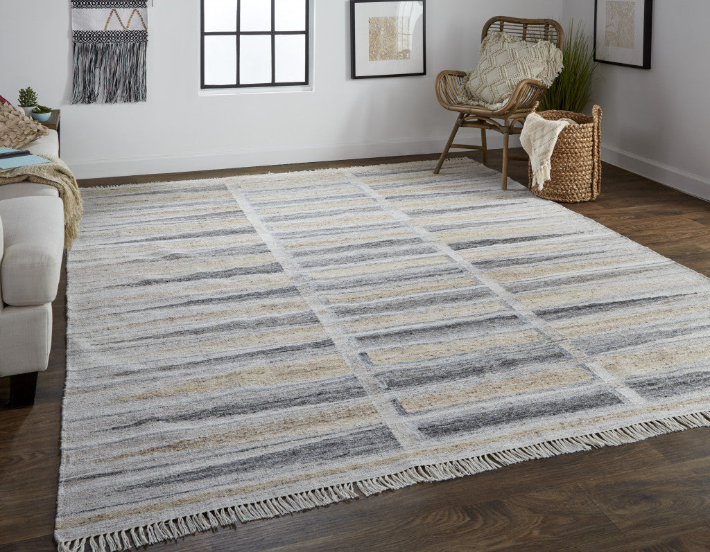 5' X 8' Tan Gray And Taupe Geometric Hand Woven Stain Resistant Area Rug With Fringe