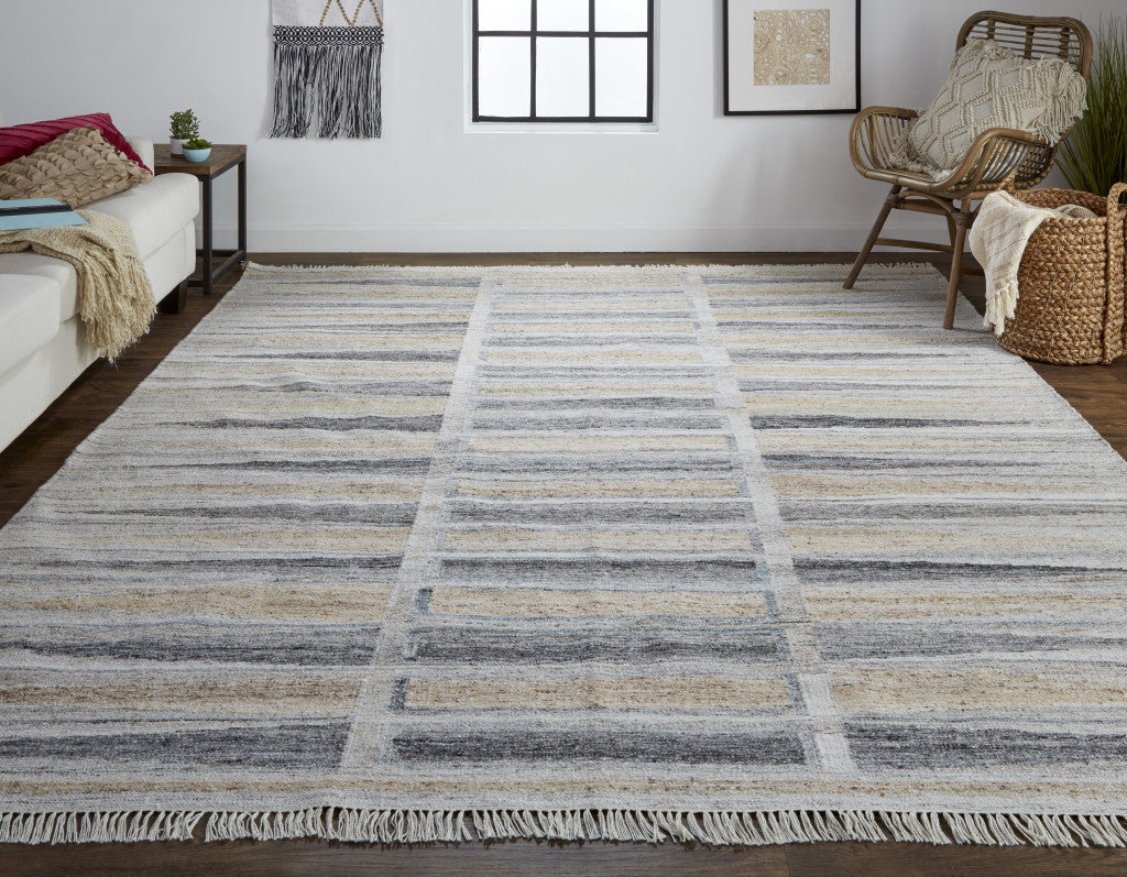 5' X 8' Tan Gray And Taupe Geometric Hand Woven Stain Resistant Area Rug With Fringe