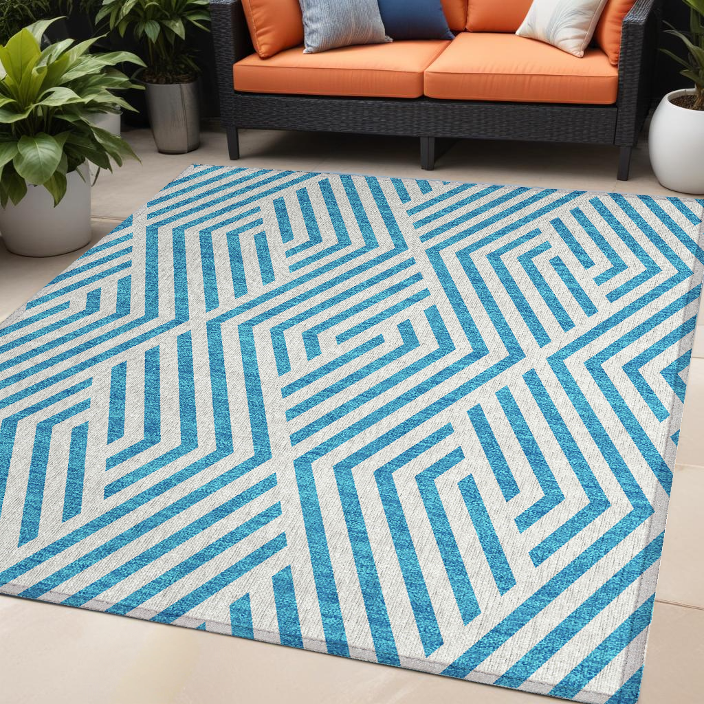 5' X 8' Teal and White Geometric Washable Non Skid Indoor Outdoor Area Rug