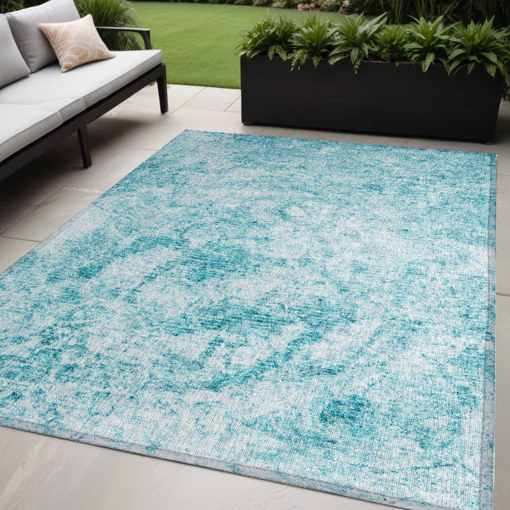 5' X 8' Teal Abstract Washable Non Skid Indoor Outdoor Area Rug