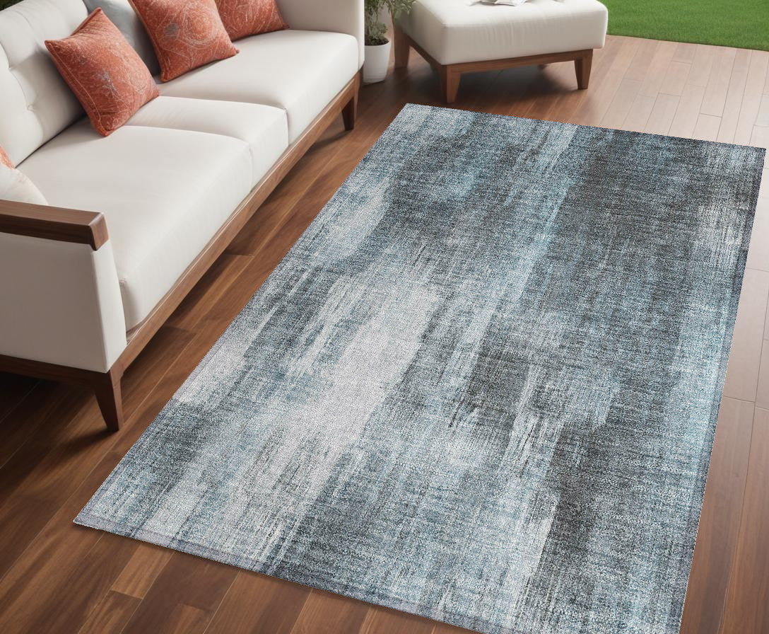 5' X 8' Teal Abstract Washable Non Skid Indoor Outdoor Area Rug